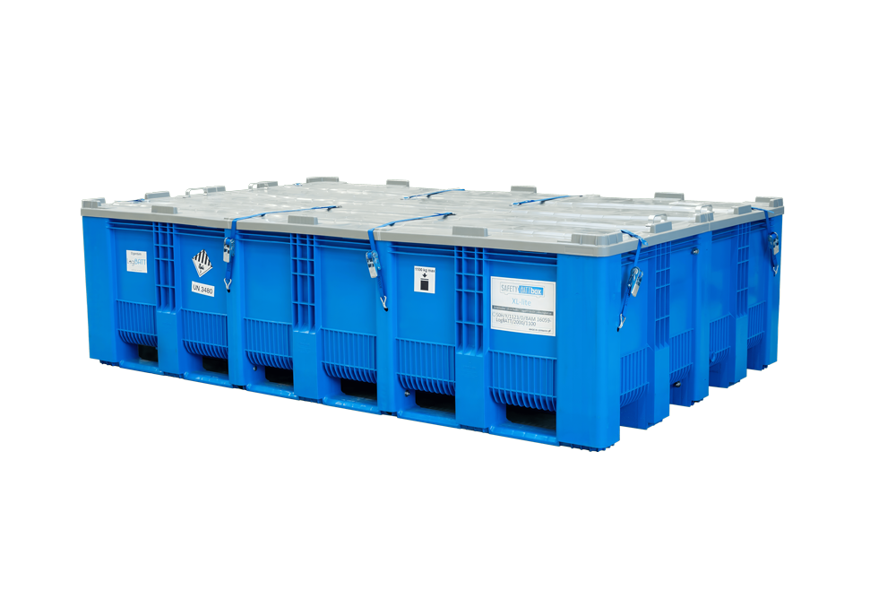 Three large blue plastic containers with silver-grey lids and labels standing side by side