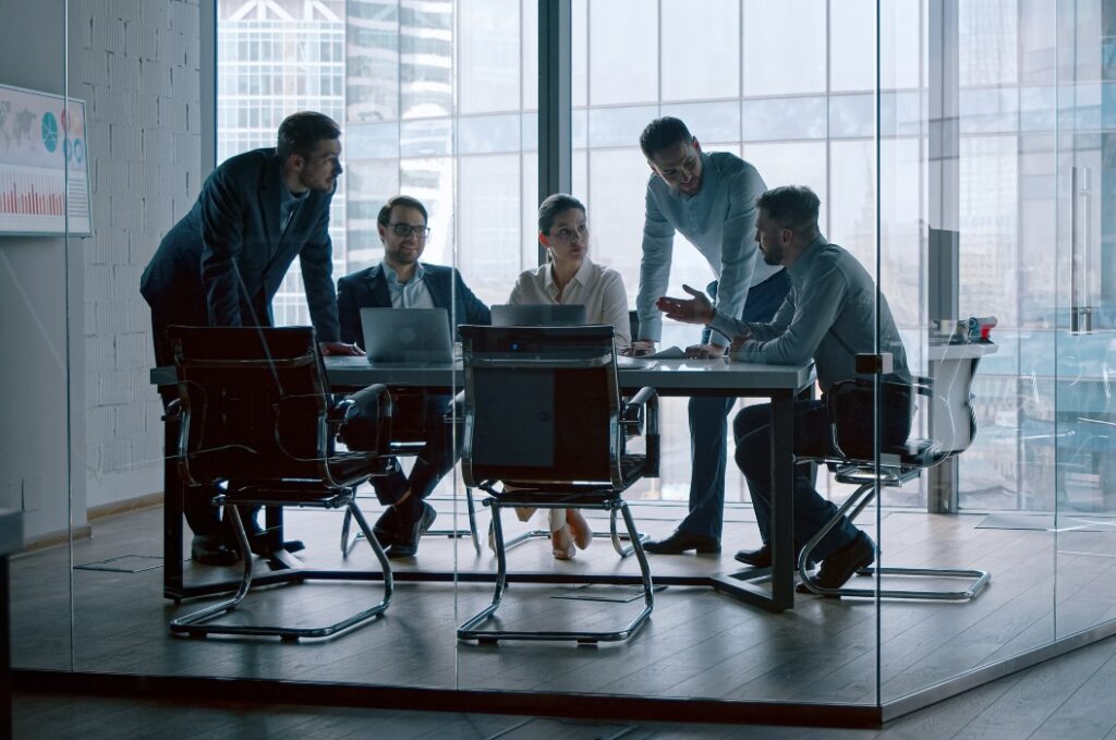 Young professionals having a discussion at a meeting in a modern office