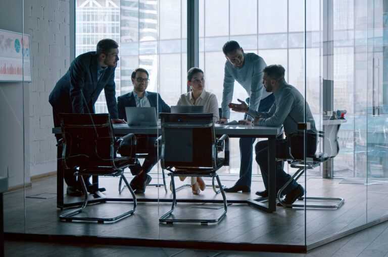 Young professionals having a discussion at a meeting in a modern office